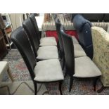 A set of six high back chairs