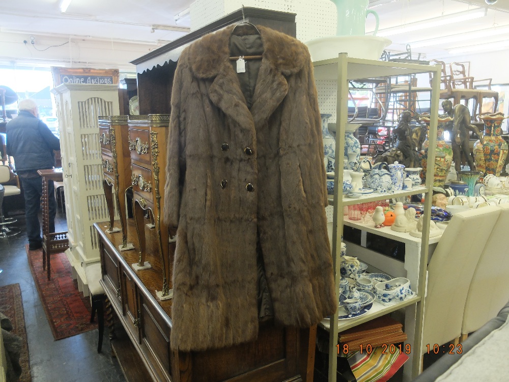 A ladies fur coat, good condition, hooks intact, approx.