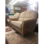A rattan sofa and armchair