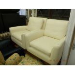 A pair of leather swivel armchairs