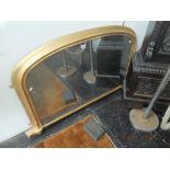 A Victorian gilt over mantle mirror with original mirror glass