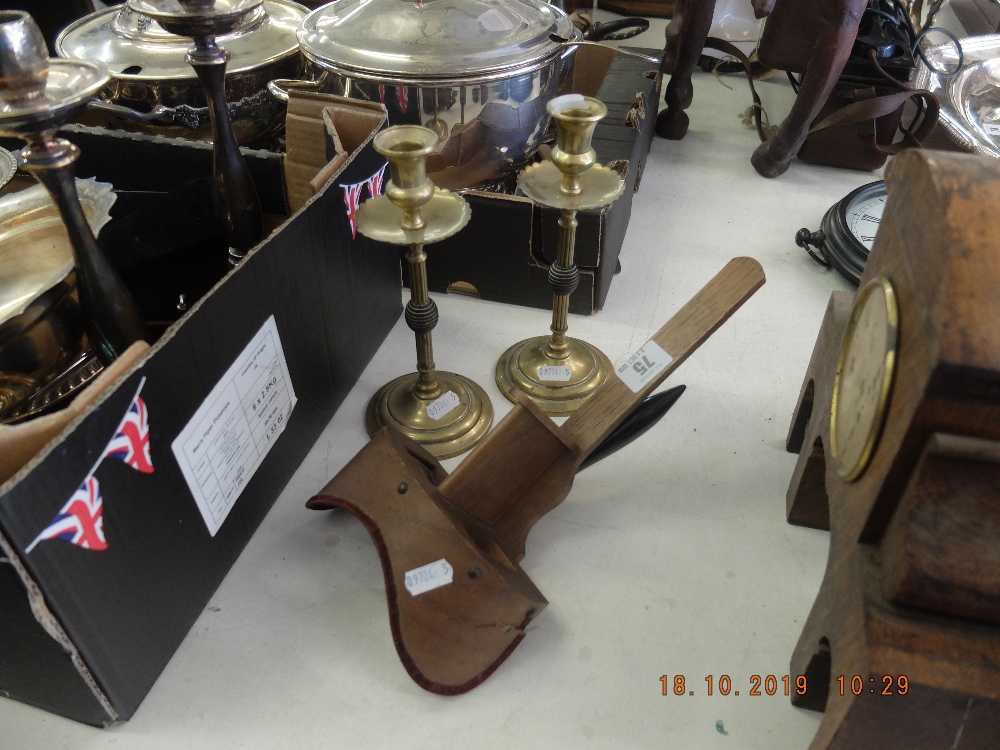 A pair of brass candlesticks plus a viewfinder (A/F)