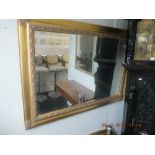 A gilt framed mirror