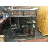 An oriental lacquered display cabinet