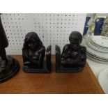 A pair of bronze figural bookends