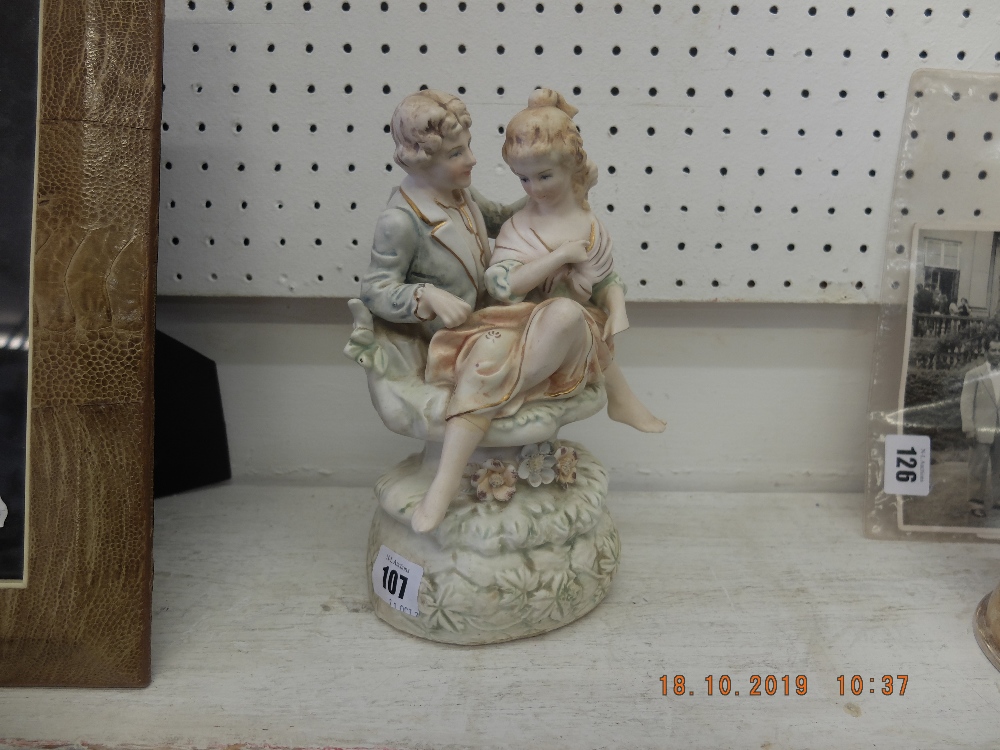 A bisque couple figure