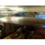 A Regency mahogany oval tilt top table on splayed base