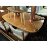 A Teak retro extending dining table with two leaves