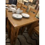 A contemporary oak arts and crafts style extending dining table and ten chairs