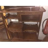 An oriental hardwood display cabinet