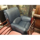 A blue leather reclining arm chair