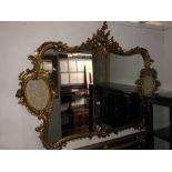 A gold mirror with plaques