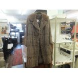 A ladies fur coat, good condition, hooks intact, approx.