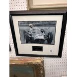A framed autographed photo of Stirling Moss