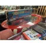 A red retro style coffee table with red edged glass