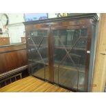 A mahogany glazed bookcase