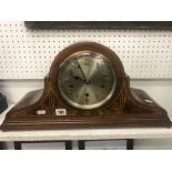 An inlaid chiming mantle clock