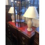 A pair of marble lamps and shades