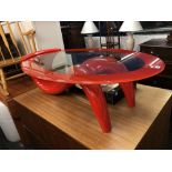 A red retro style coffee table with red edged glass