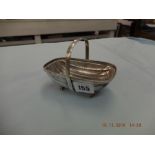 An Asprey & Co cast silver bonbon basket London 1993