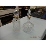 Two decanters with hallmarked silver collars