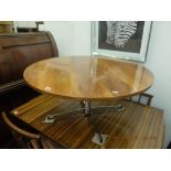 A mid century Heals rosewood coffee table on four star aluminum base possibly by Fitz Hansen