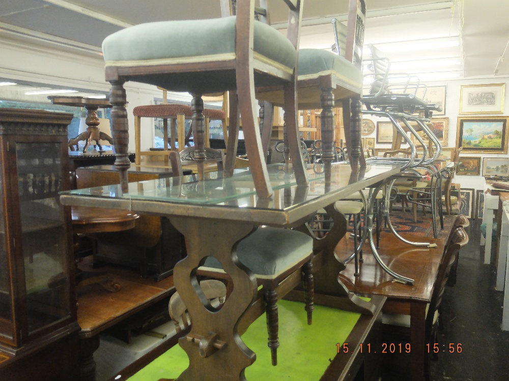 A refectory table and four chairs