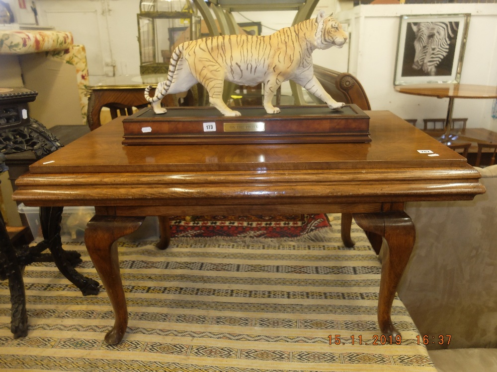 A metamorphic walnut games table