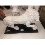 A marbled lion on base