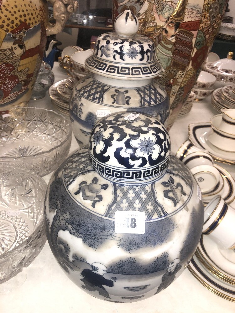 Two blue and white lidded vases