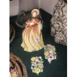 A Royal Doulton figurine and two Doulton posies
