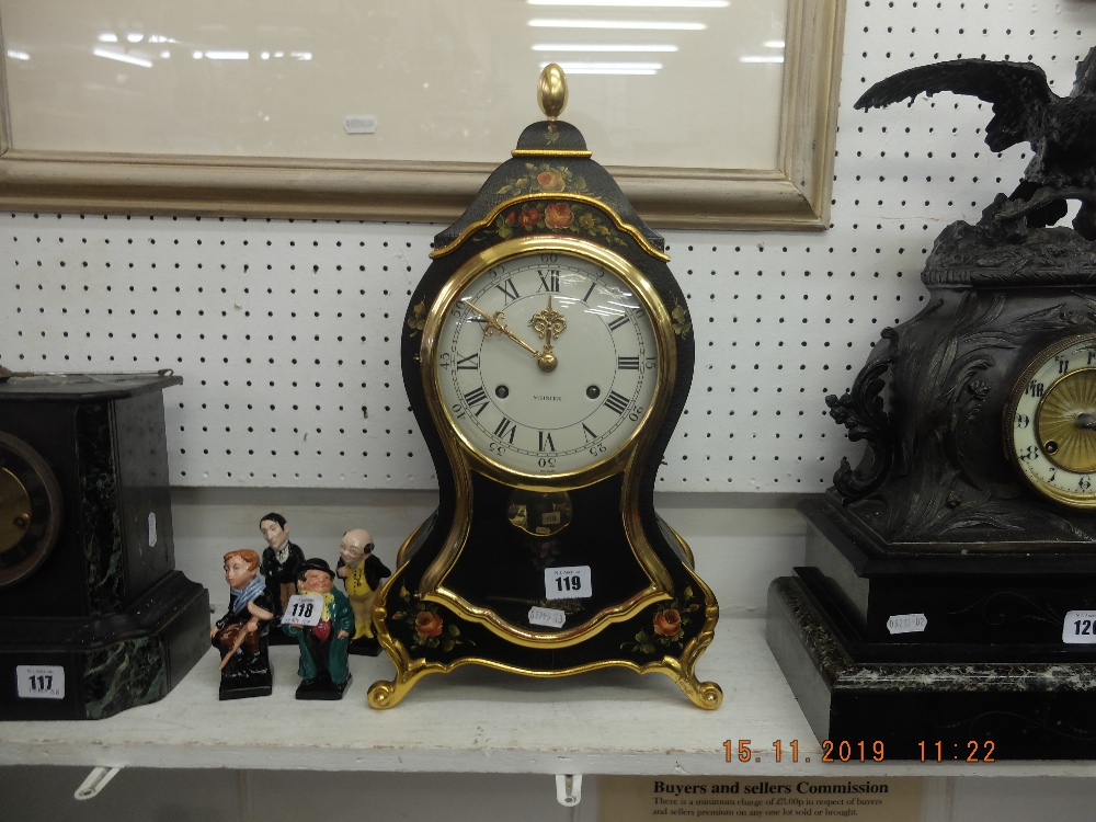 A decorative Swiss mantle clock