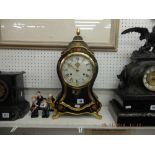 A decorative Swiss mantle clock