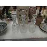 Three cut glass decanters