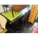 A large mahogany leather top desk