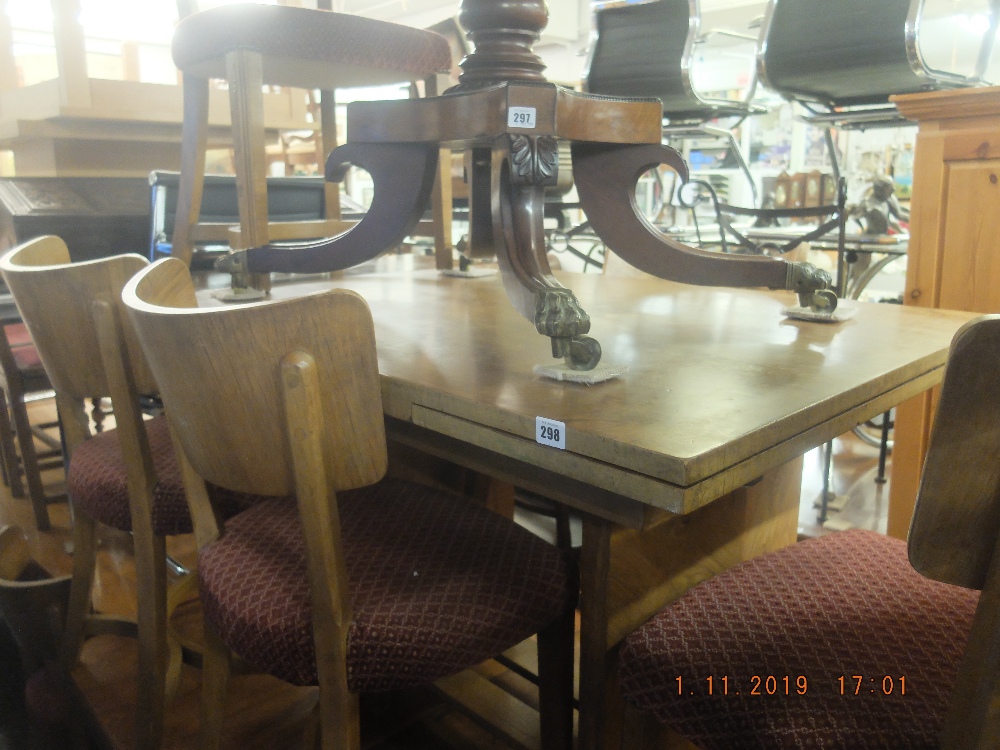A walnut draw leaf table and six chairs