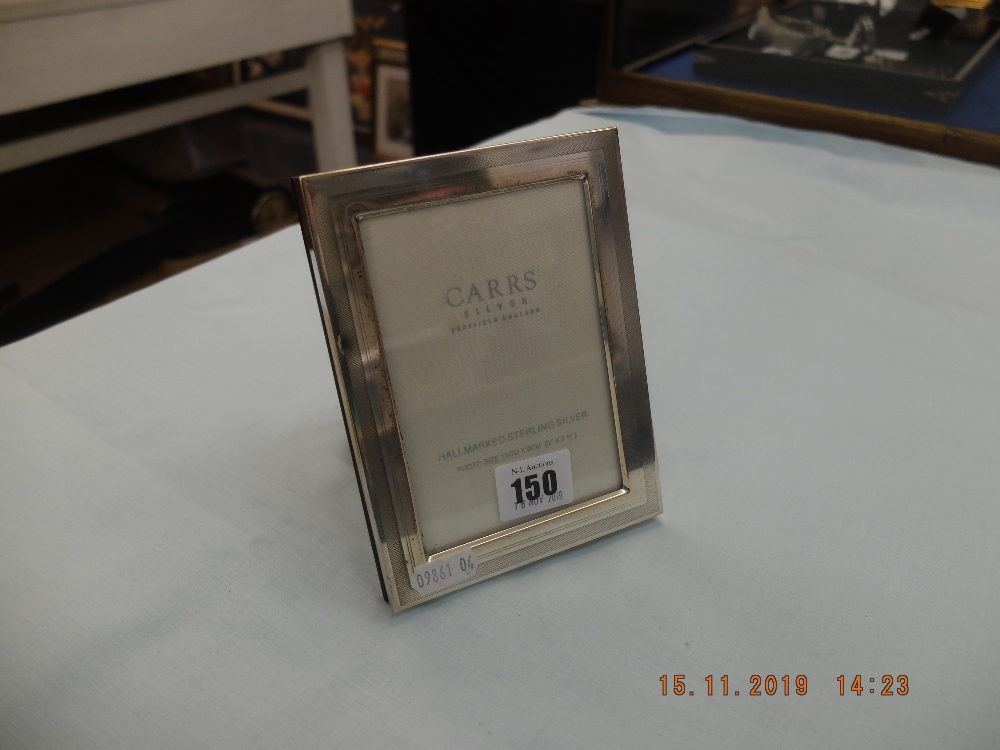 A hallmarked silver photo frame