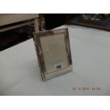 A hallmarked silver photo frame