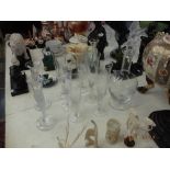 A Faberge crystal decanter and six glasses plus a pair of candlesticks,