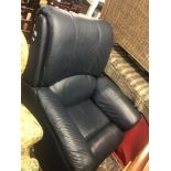 A blue leather reclining arm chair