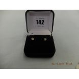 142 A pair of 18ct gold and diamond stud earrings approximately 0.50ct total