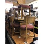 A walnut draw leaf table and six chairs