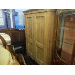 A 19th century pine double wardrobe