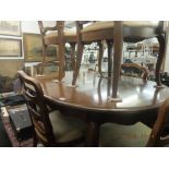 An extending dining table and six chairs