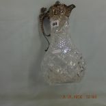A good quality cut crystal and silver plated claret jug
