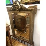 An late 19th century/ early 20th century gilt mirror.