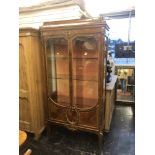 A 19th century early 20th century inlaid and ormulu vitrine.