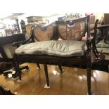 A mahogany bergere two seater salon sofa