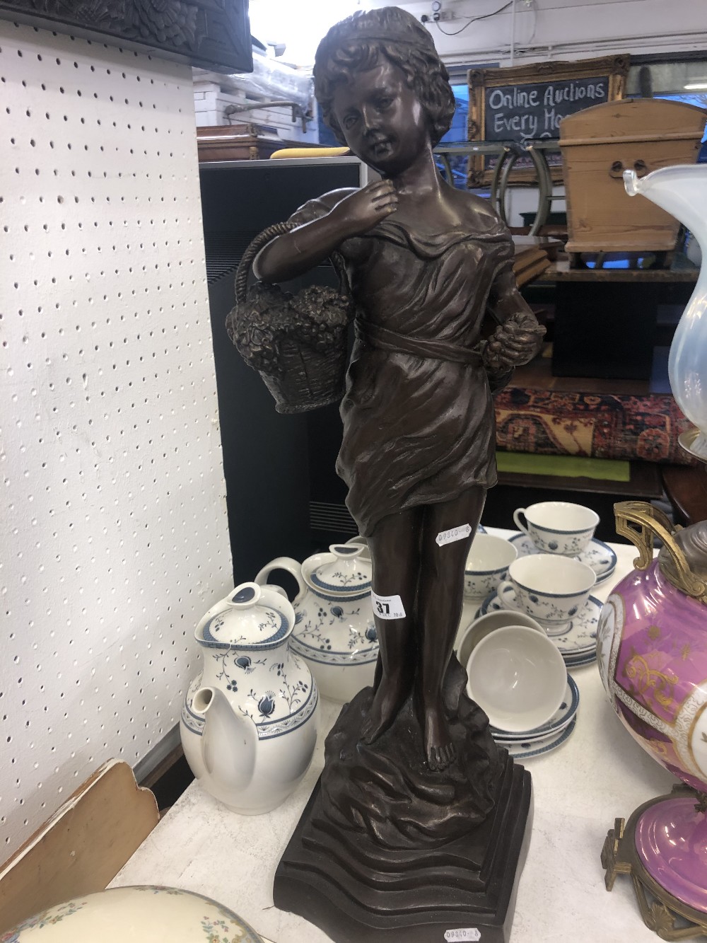 A bronze girl with basket