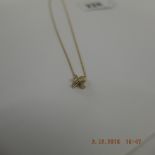 An 18ct gold Tiffany & Co diamond signature X necklace weight 2 grams